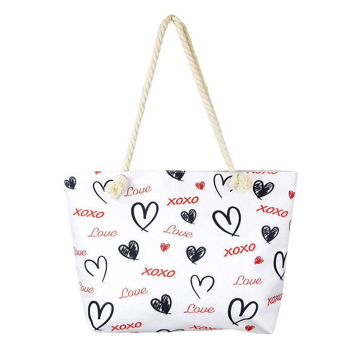 XOXO Love Beach Bag is the perfect accessory for a day at the beach. Crafted with durable materials, it can hold all your beach essentials with ease. Featuring a spacious design and a stylish XOXO pattern, this bag ensures you're ready for a fun day in the sun. Enjoy a carefree beach day with this must-have accessory. 