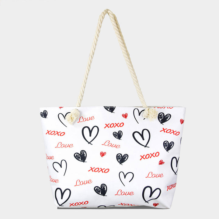 XOXO Love Beach Bag is the perfect accessory for a day at the beach. Crafted with durable materials, it can hold all your beach essentials with ease. Featuring a spacious design and a stylish XOXO pattern, this bag ensures you're ready for a fun day in the sun. Enjoy a carefree beach day with this must-have accessory. 