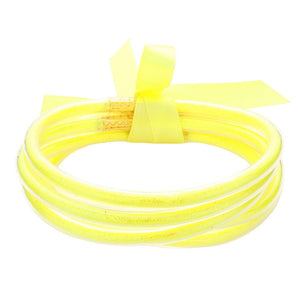 Yellow 5PCS Glitter Jelly Tube Bangle Bracelets, these 5 colorful, glittered bracelets are perfect for adding a fashionable yet eye-catching touch to any outfit. Made from jelly tubes and shimmering glitter, they are durable and comfortable to wear. Add a pop of color and sparkle to your wardrobe with these stylish bracelets.
