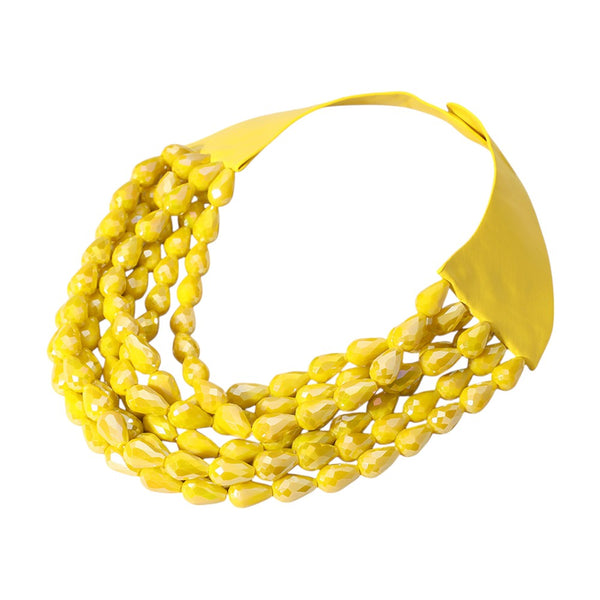 Yellow Chunky Acrylic Teardrop Beaded Multi-Layer Faux Leather Necklace features chunky faceted acrylic teardrop beads layered on a faux leather magnetic necklace. The unique design offers a modern, edgy look sure to add a touch of style to any outfit. The magnetic closure makes it easy to put on and take off, providing both convenience and security. Perfect for any occasion, this necklace is a must-have for any fashion-forward individual looking to make a statement. 