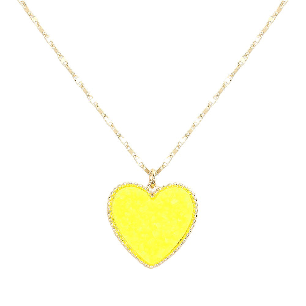 Yellow Druzy Heart Pendant Necklace, this is a stunning accessory that adds a touch of sparkle to any outfit. The druzy heart pendant is beautifully crafted and catches the light for a mesmerizing effect. With its unique design and high-quality materials, this necklace is sure to make a statement and elevate your look.