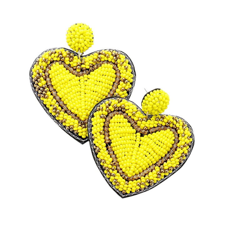 Yellow Seed Bead Heart Earrings are handcrafted with tiny seed beads, making them lightweight and comfortable to wear. Perfect for adding a touch of whimsy to any outfit, these earrings are ideal for everyday wear or special occasions. The unique heart shape adds a romantic and playful touch to your look.