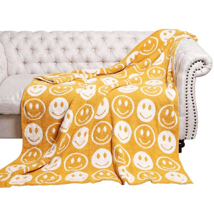 Yellow Smile Patterned Reversible Throw Blanket, this ultra-soft throw provides warmth and comfort to any living space. It's made from high-quality materials and features a reversible design featuring a fun, cheerful smile pattern that adds a touch of personality to your home. Perfect winter gift for family and friends.