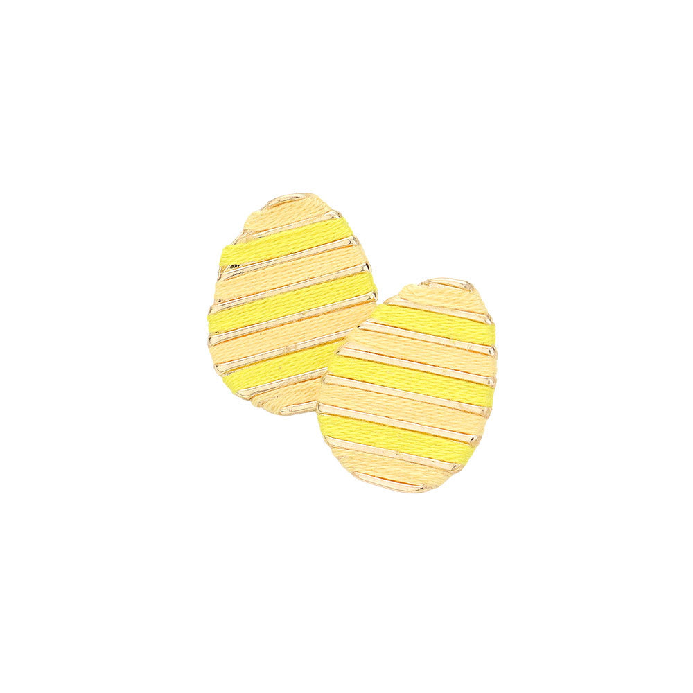Yellow Thread Wrapped Easter Egg Stud Earrings are expertly crafted and offer a unique twist on traditional Easter accessories. The thread wrapping adds texture and depth, making them a beautiful addition to any outfit. Handmade with quality materials, these earrings are sure to become a staple in your jewelry collection.