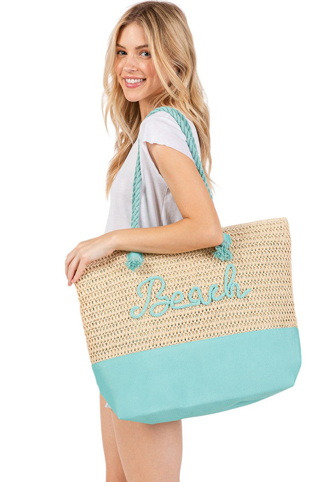 BEACH Letter Color Sewn Rope and Crochet Strap Bag combines artisanal craftsmanship with practical design. Featuring a durable rope body accented by colorful sewn lettering and a hand-crocheted strap, this bag offers both style and comfort. Its lightweight construction makes it ideal for beach outings, while the spacious interior accommodates essentials effortlessly. Perfect for those seeking a unique accessory that blends texture and vibrant detail with everyday functionality. 