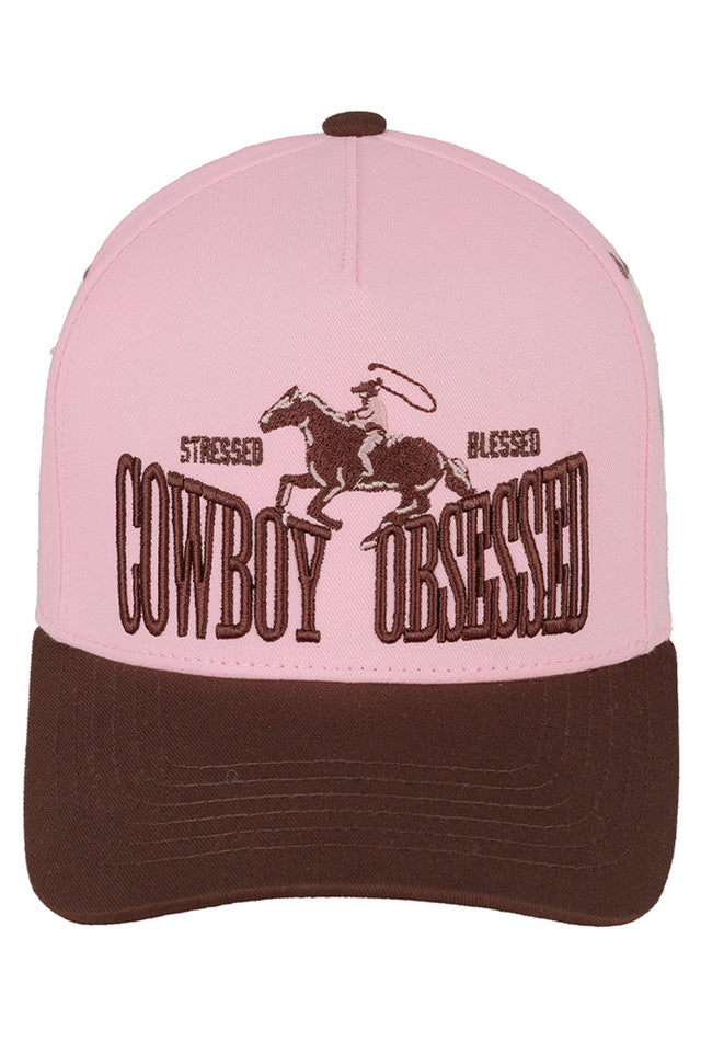 Brown Pink C.C Cowboy Obsessed Embroidered Cotton Trucker Cap combines classic style with durable comfort. Crafted from breathable cotton, this trucker cap features detailed embroidery that highlights a cowboy-inspired design, perfect for enthusiasts seeking both function and flair. Its adjustable snapback ensures a secure fit, making it ideal for outdoor activities or casual wear. This cap offers a timeless accessory that blends rugged charm with everyday practicality. 