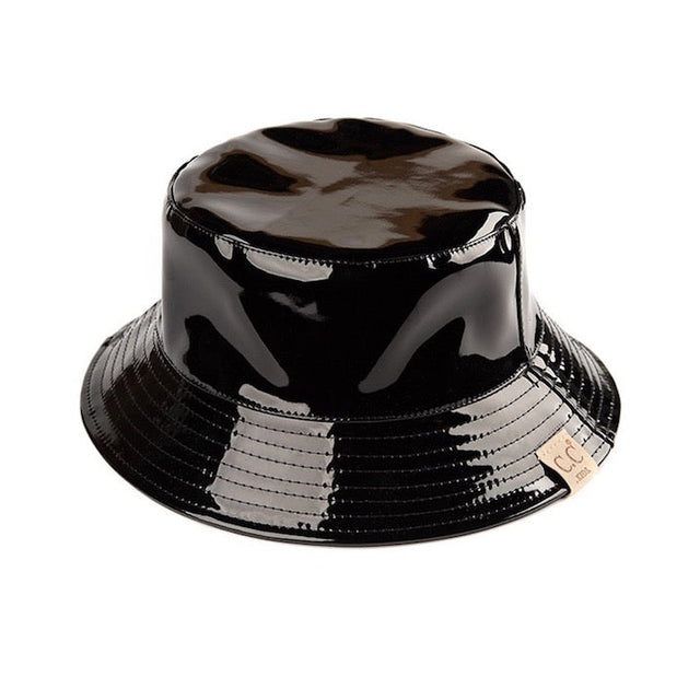 Black C.C Kids Shiny Solid Color Reflective Enamel Detailed Rain Bucket Hat; this rain hat is snug on the head and works well to keep rain off the head, out of the eyes, and also the back of the neck. Wear it to lend a modern liveliness above a raincoat on trans-seasonal days in the city. Perfect Gift for that fashion-forward friend