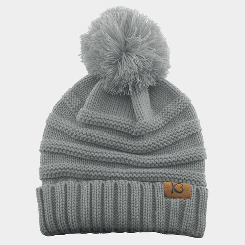 Gorro de punto trenzado con pompón grueso y canalé - Gris