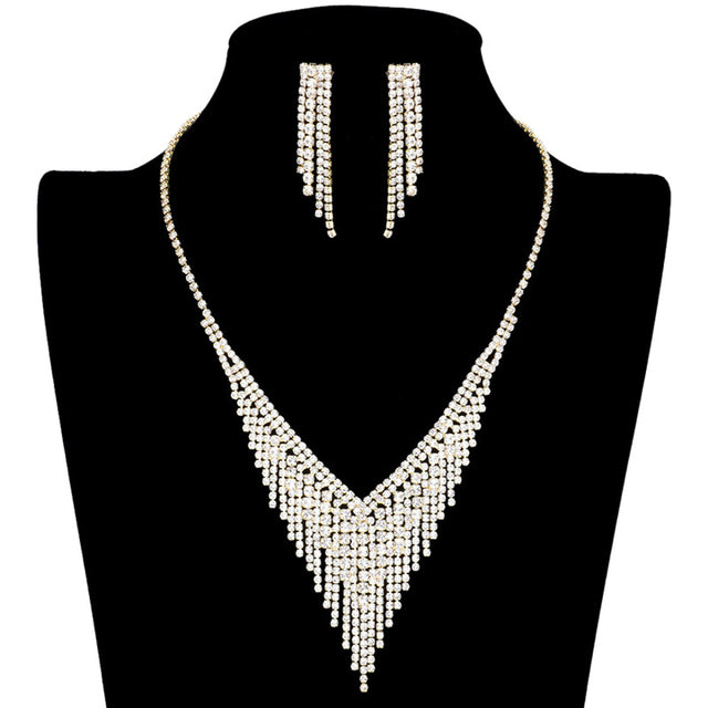 Brighten up your look with this dazzling Gold Rhinestone Fringe Necklace Earring Set. Expertly crafted from sparkling rhinestones, this jewelry set is an elegant addition to any ensemble. Perfect Birthday Gift, Christmas Gift, Anniversary Gift, Prom, Valentine's Day Gift, Regalo Cumpleanos, Aniversario, Regalo Navidad