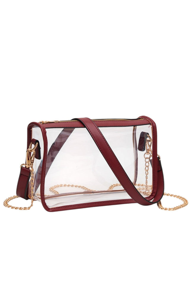Burgundy Clear Rectangle Stadium Concert Crossbody Bag offers a sleek, transparent design ideal for event security compliance. Its rectangular shape provides ample space for essentials while maintaining a compact profile. The adjustable crossbody strap ensures comfortable wear, making it perfect for concerts and stadium visits where quick access and visibility are essential. Durable materials guarantee longevity, combining practicality with modern style for hassle-free outings. 