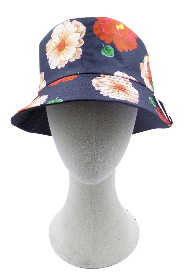 Blue Flower Print Bucket Hat combines fashion-forward design with practical sun protection. Crafted with durable materials, it features an all-over floral pattern that adds a distinctive touch to casual outfits. The classic bucket silhouette provides excellent coverage while maintaining breathability, making it ideal for outdoor activities or elevating everyday ensembles. 