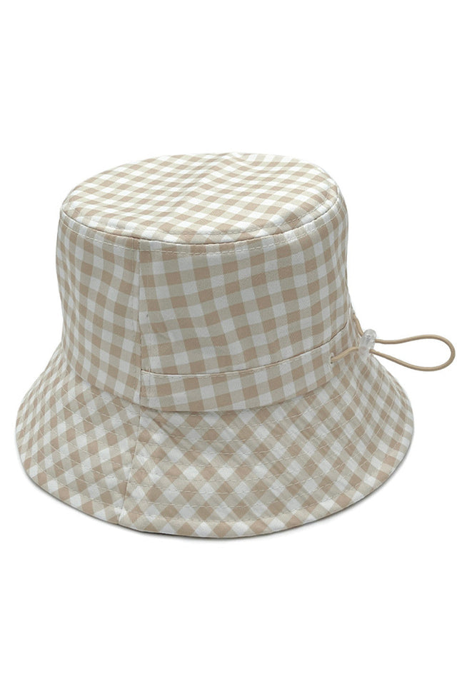 Beige GINGHAM PATTERN DARW STRING BUCKET HAT features a functional drawstring for customizable fit and security. The classic checkered pattern delivers timeless aesthetic appeal while providing essential sun protection. Constructed with quality materials, it offers durability and comfort for daily wear across various seasonal activities. 