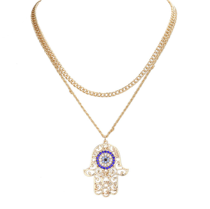 Ward off bad vibes in style with this Rhinestone Evil Eye Filigree Hamsa Pendant Layered Necklace! Featuring a sparkling evil eye and intricate filigree hamsa, it's the perfect way to protect yourself in a fashionable way. Perfect Birthday Gift, Anniversary Gift, Christmas Gift, Regalo Cumpleanos, Regalo Navidad, etc