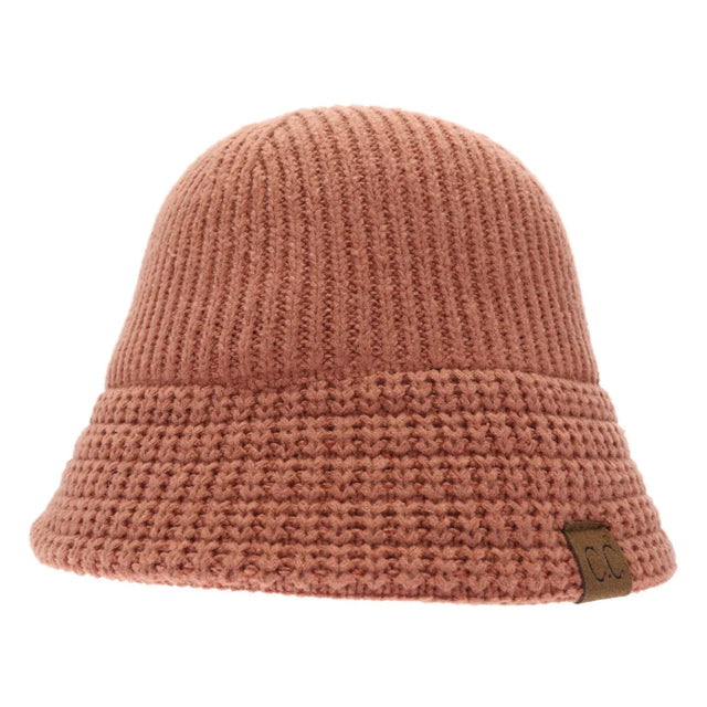 Brick Knitted Cloche C.C Bucket Hat combines classic cloche styling with the casual appeal of a bucket hat, crafted from soft, durable knit fabric. Its structured yet flexible design offers comfortable wear and a flattering fit, making it an ideal accessory for cooler seasons. This hat offers both warmth and style, making it perfect for adding a sophisticated edge to everyday outfits. 
