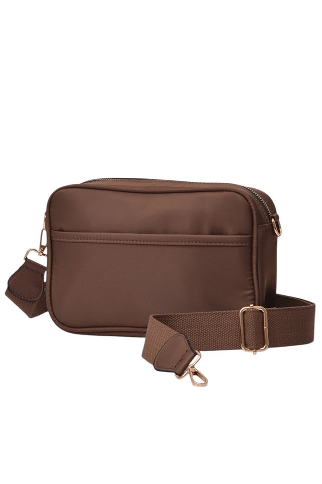 Nylon Crossbody Camera Bag offers a lightweight yet durable solution for photographers on the move. Crafted from high-quality nylon, it provides reliable protection against everyday wear and weather. Its compact design ensures easy portability, while adjustable straps allow for a comfortable fit. Multiple compartments keep your camera and accessories organized and accessible, making it an essential accessory for capturing moments effortlessly. 