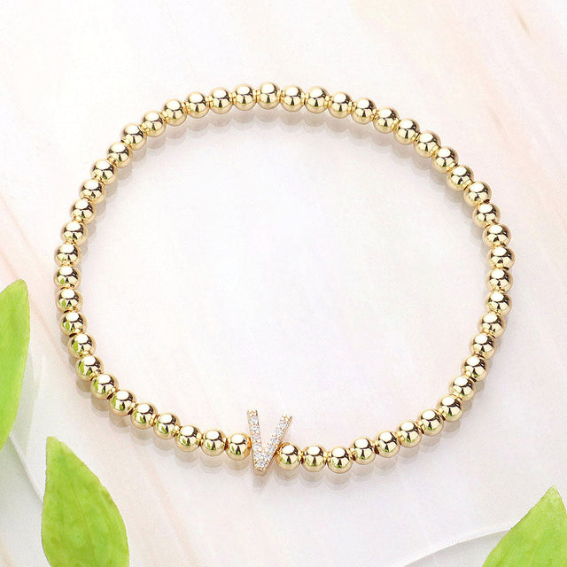 Gold SECRET BOX_ V Monogram Initial Stretch Bracelet