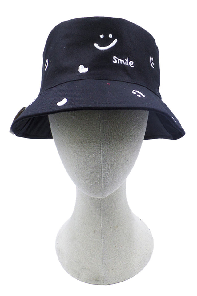 Black Smile and Heart Pattern Bucket Hat features an eye-catching smile and heart pattern, expertly designed to balance whimsical aesthetics with functional headwear. The structured silhouette maintains its shape while providing optimal sun protection with a substantial brim. Superior stitching and quality materials ensure durability through regular wear, making it an essential accessory for the discerning customer seeking both style and practicality.