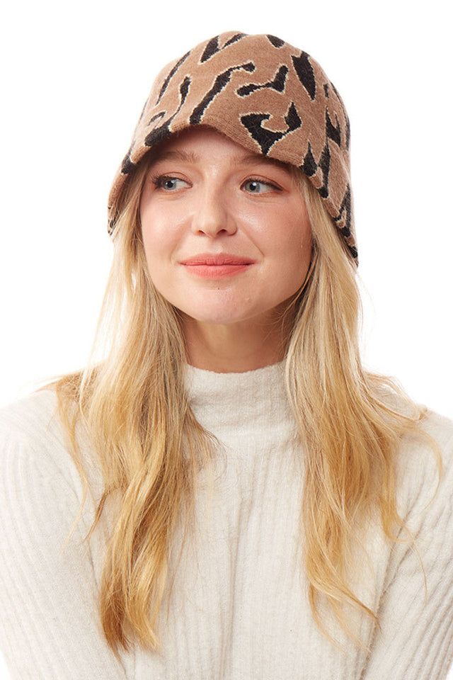 Taupe Soft Fabric Leopard Bucket Hat combines durability with fashion-forward design. Constructed with premium textiles that offer a plush feel against the skin, the bold leopard pattern adds visual interest while maintaining versatility. The structured yet flexible brim provides optimal sun protection without compromising style. An essential accessory for the discerning consumer seeking both functionality and contemporary aesthetic appeal. 