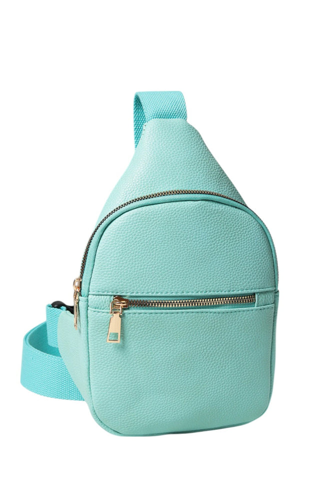 Solid PU Sling Bag combines durability with sleek design, crafted from high-quality polyurethane for a lightweight yet sturdy feel. Its compact size and adjustable strap offer comfortable, hands-free carrying, making it ideal for daily use or travel. The bag’s minimalist style ensures versatility, complementing various outfits while securely holding essentials. Perfect for those seeking a practical and stylish accessory with expert craftsmanship.