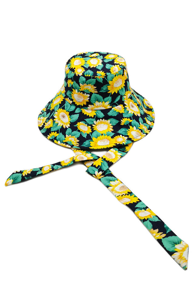Navy SUNFLOWER PRINT CHINE TIE BUCKET HAT is a distinctive bucket hat that showcases a distinctive sunflower print pattern complemented by a functional chin tie for optimal stability. The premium construction ensures durability while maintaining breathability, making it suitable for extended outdoor wear. The classic bucket silhouette provides comprehensive sun protection with a fashionable aesthetic. Ideal for both practical weather defence and elevating casual ensembles.