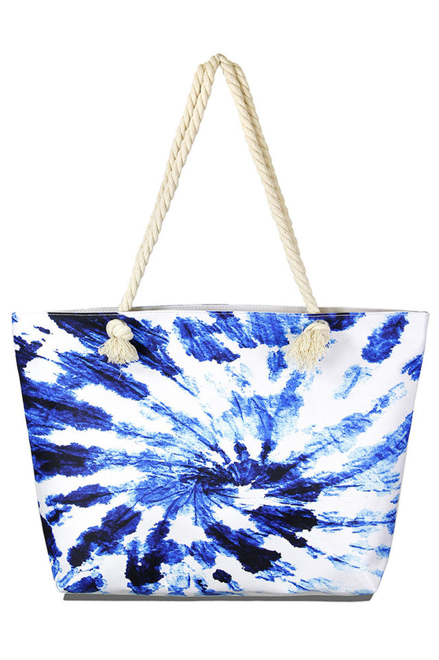 Tie Dye Beach Bag combines vibrant style with practical design, perfect for carrying all your essentials to the shore. Crafted from durable materials, it offers ample space and sturdy handles for comfortable transport. Its eye-catching tie dye pattern adds a trendy, summery touch, making it an ideal accessory for beach days, picnics, or casual outings.