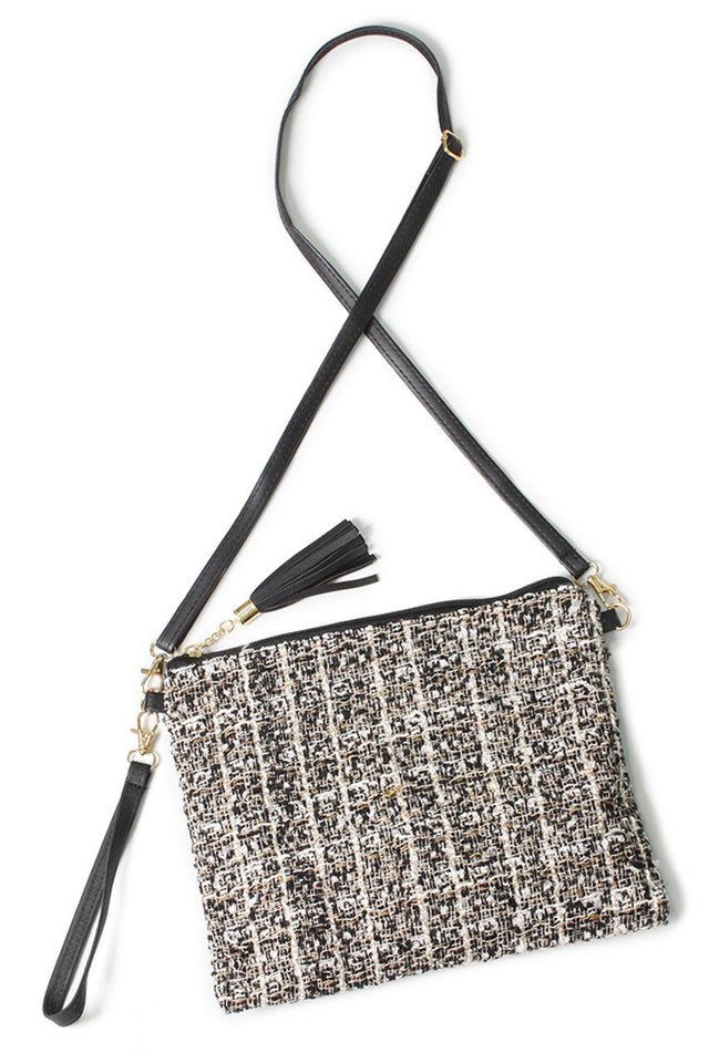 Tweed Lurex Crossbody Bag expertly blends timeless tweed fabric with a subtle lurex thread, creating a sophisticated accessory that enhances any ensemble. Designed for versatility, its compact size and adjustable strap provide comfortable, hands-free wear. Durable and stylish, this bag is ideal for those seeking a refined yet practical addition to their wardrobe. 