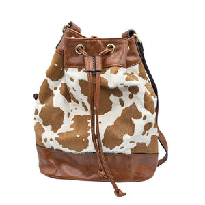 Beige Adjustable Cow Patterned Faux Leather Drawstring Crossbody Bag. Look like the ultimate fashionista carrying this small quilted bag! It will be your new favorite accessory. Easy to carry specially lightweight ideal for a night out on the town.  Perfect Gift for Birthday, Holiday, Christmas, New Years, Anniversary.