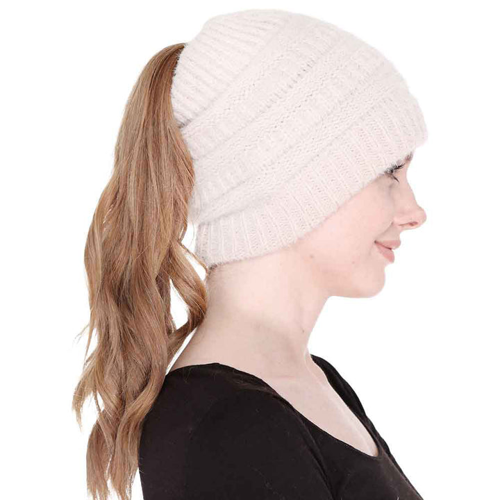 Beige Cable Knit Ponytail Beanie Hat, Perfect for pulling your messy bun or high ponytail, while keeping ears warm. Great to wear while exercising in cold weather to keep your hair up and your head warm. It's the autumnal touch you need to finish your outfit in style. The cable knit hat can be used on your working day, You can also wear it in outdoor sports: running, biking etc. Awesome winter gift accessory!