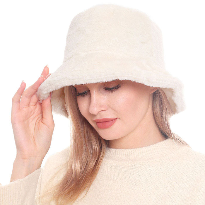 Beige Trendy & Fashionable Winter Faux Fur Solid Bucket Hat. Before running out the door into the cool air, you’ll want to reach for this toasty beanie to keep you incredibly warm. Accessorize the fun way with this beanie hat, it's the autumnal touch you need to finish your outfit in style. Awesome winter gift accessory!