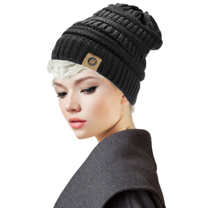 Black Acrylic Solid Knitted Hashtag Beanie Hat. Before running out the door into the cool air, you’ll want to reach for these toasty beanie to keep your hands incredibly warm. Accessorize the fun way with these beanie, it's the autumnal touch you need to finish your outfit in style. Awesome winter gift accessory!