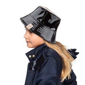 Black C.C Kids Shiny Solid Color Reflective Enamel Detailed Rain Bucket Hat; this rain hat is snug on the head and works well to keep rain off the head, out of the eyes, and also the back of the neck. Wear it to lend a modern liveliness above a raincoat on trans-seasonal days in the city. Perfect Gift for that fashion-forward friend