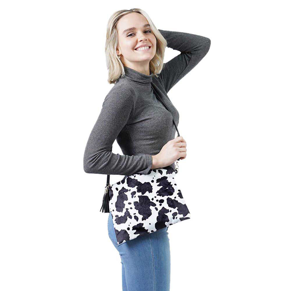 Black Cow Patterned Crossbody Clutch Bag, looks like the ultimate fashionista when carrying this chic bag. It will be your new favorite accessory to hold onto all your items. Easy to carry especially when you need hands-free and lightweight to run errands or a night out in the town. A nice gift for Birthdays, holidays, Christmas, New Year, etc.