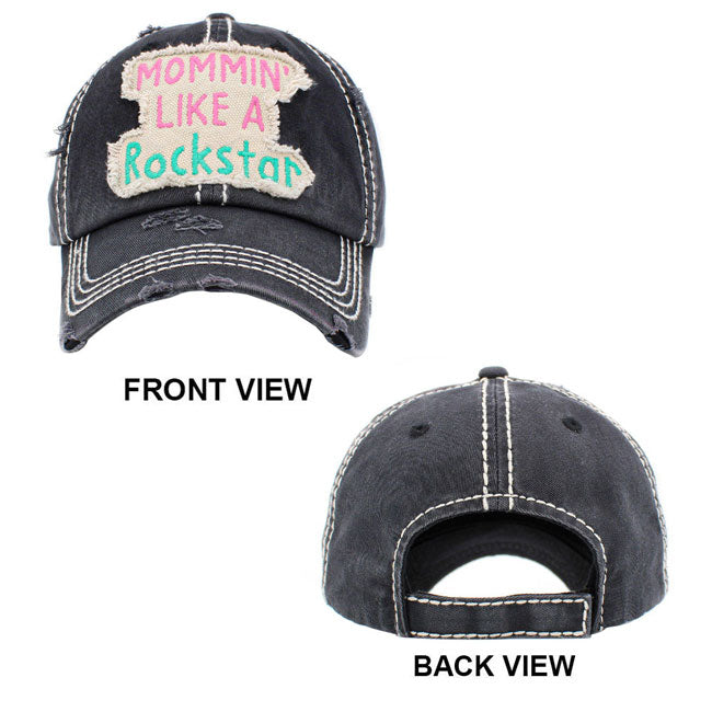 Black Mommin Like A Rockstar Message Vintage Baseball Cap. Fun cool vintage cap perfect for the mommin who is in Charge! Perfect for walks in sun or rain, great for a bad hair day. Soft textured, embroidered message and distressed contrast stitching baseball cap with fun statement will become your favorite cap. Velcro Adjustable Back