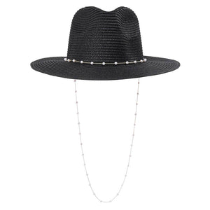 Black Pearl Embellished Panama Straw Sun Hat, The Chain Strap Straw Panama Hat is one of the most exquisite hats to date. Decorated with pearls, it brings summer sophistication right to your look. It is the trendy hat of the summer!