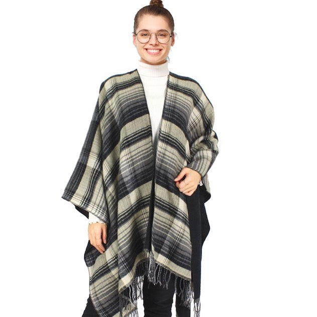 Black Reversible Plaid Check Patterned Tassel Cape Poncho, with the latest trend in ladies' outfit cover-up! the high-quality knit poncho is soft, comfortable, and warm but lightweight. It's perfect for your daily, casual, evening, vacation, and other special events outfits. A fantastic gift for your friends or family.