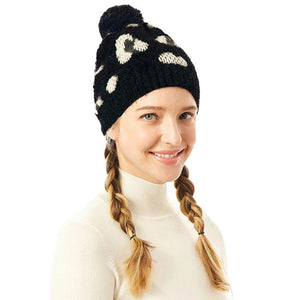 Black Soft Fuzzy Leopard Print Beanie Hat With Pom Pom, before running out the door into the cool air, you’ll want to reach for this toasty beanie to keep you incrediblywarm. Accessorize the fun way with this faux fur pom pom hat, these leopard themed beanie hat have the autumnal touch you need to finish your outfit in style. Awesome winter gift accessory! Perfect Gift Birthday, Christmas, Stocking Stuffer, Secret Santa, Holiday, Anniversary, Valentine's Day, Loved One.