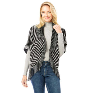 Black Striped Chenille Shrug With Fringe, is complete protection from cold weather and chill that fits with any of your outfits easily and makes your outfit absolutely lucrative. Different color variation makes it more attractive. It's easy to put on and off. This soft patterned shrug gives you a unique yet beautiful look. It ensures your upper body keeps perfectly toasty when the temperatures drop.