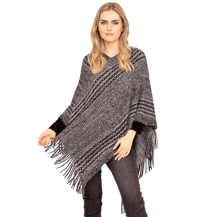 Black Striped Knit Tassel Poncho, is the perfect accessory that amps up your confidence with perfect beauty adding the right amount of luxe to your ensemble. It's a luxurious, trendy, super soft chic capelet that keeps you warm and toasty on cold days and winter. From stylish layering camis to relaxed tees, you can throw it on over so many pieces elevating any casual outfit!