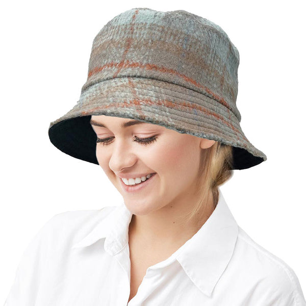 Blue Polyester Plaid Check Patterned Bucket Hat, this bucket hat doubles as a rain hat and is snug on the head and stays on well. It will work well to keep the rain off the head and out of the eyes and also the back of the neck. Wear it to lend a modern liveliness above a raincoat on trans-seasonal days in the city.