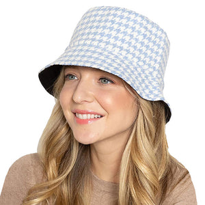 Blue Polyester Houndstooth Patterned Bucket Hat, this bucket hat doubles as a rain hat and is snug on the head and stays on well. It will work well to keep the rain off the head and out of the eyes and also the back of the neck. Wear it to lend a modern liveliness above a raincoat on trans-seasonal days in the city.