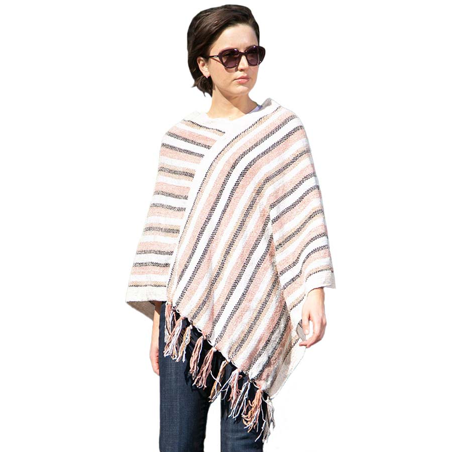 Blush Stripe Patterned Poncho, stripped designed beauty gives your outlook more gorgeousness and will make your day. It fits from stylish layering camis to relaxed tees. It will keep the body perfectly warm and represents your awesome look everywhere. It will become your favorite accessory.
