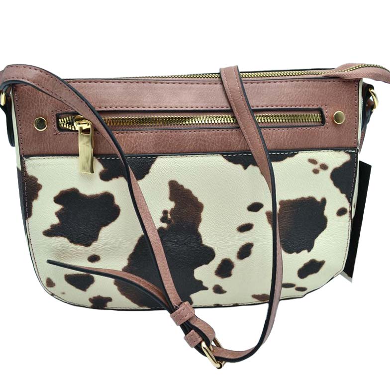 Blush Stylish Cowprint Pattern Crossbody Handbag, This Cowprint handbag can be worn crossbody or on the shoulder comfortably. This comfortable handbag is made of high-quality durable PU leather which is also beautiful at the same time. This handbag features one big compartment for your daily essentials and a little more. Show your trendy choice and smartness with this awesome cow-print bag. 