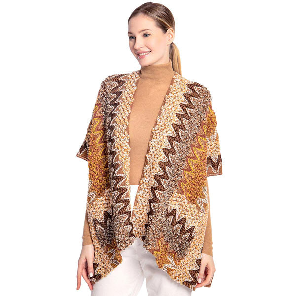 Brown Boho Patterned Front Pocket Ruana,  is the perfect accessory to represent your beauty with comfortability.This boho patterned front pocket ruana isa sophisticated, flattering, and cozy poncho drapes beautifully for a relaxed, pulled-together look. A perfect gift accessory for your friends, family, and nearest and dearest ones. 