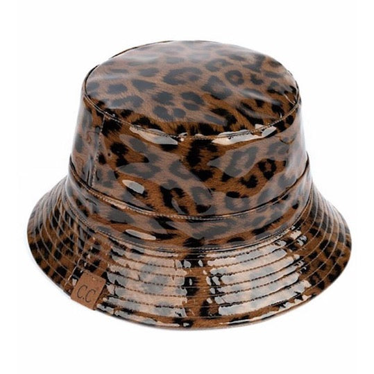 Brown C.C Leopard Patterned Shiny Animal Printed Reversible Rain Bucket Hat; this rain hat is snug on the head and works well to keep rain off the head, out of the eyes, and also the back of neck. Wear it to lend a modern liveliness above a raincoat on trans-seasonal days in the city. Perfect Gift for fashion-forward friend