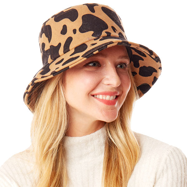 Brown Polyester One Size Cow Patterned Bucket Hat. Show your trendy side with this chic animal print hat. Have fun and look Stylish. Great for covering up when you are having a bad hair day, perfect for protecting you from the sun, rain, wind, snow, beach, pool, camping or any outdoor activities.