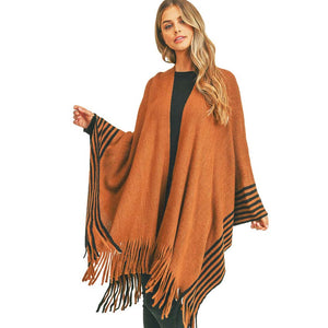 Brown Stripe Pattern Bottom Ruana, amps up your beauty with confidence with this beautiful bottom poncho. You can stand out with the contrast of different outfits. Snowflake patterned with beautiful design gives a unique decorative and fashionable look that makes your day with beautiful moments. Match perfectly with jeans and T-shirts or a vest. A perfect eye-catcher and will become one of your favorite accessories quickly.
