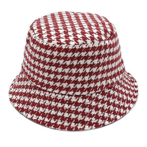 Burgundy Polyester Houndstooth Patterned Bucket Hat, this bucket hat doubles as a rain hat and is snug on the head and stays on well. It will work well to keep the rain off the head and out of the eyes and also the back of the neck. Wear it to lend a modern liveliness above a raincoat on trans-seasonal days in the city.