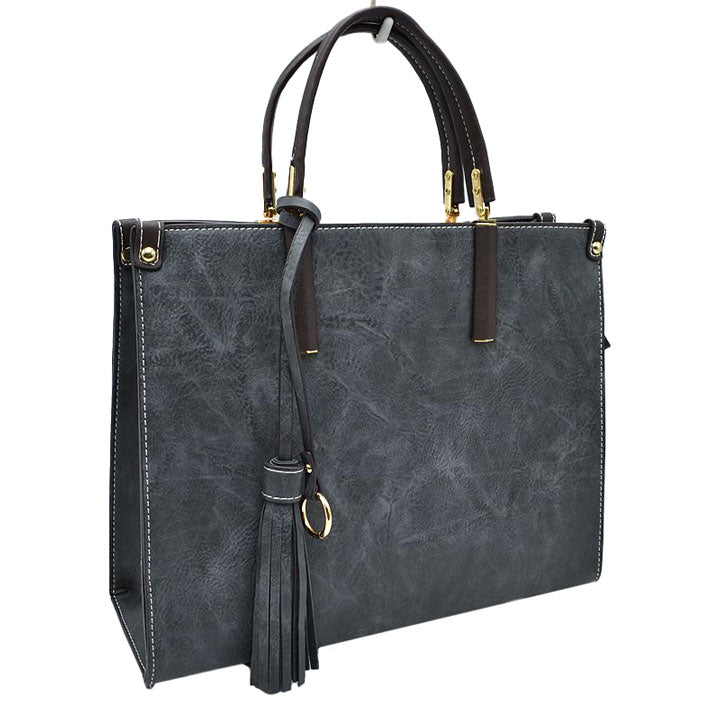 Black Large Shoulder Vegan Leather Tassel Handbag For Women. High quality Vegan Leather is a luxurious and durable, Stay organized in style with this square-shaped shopper tote bag that is fully two contrasting interior and exterior solid colors. This vegan leather handbag includes an on-trend removable tassel embellishment. Guaranteed, This will be your go-to handbag. 