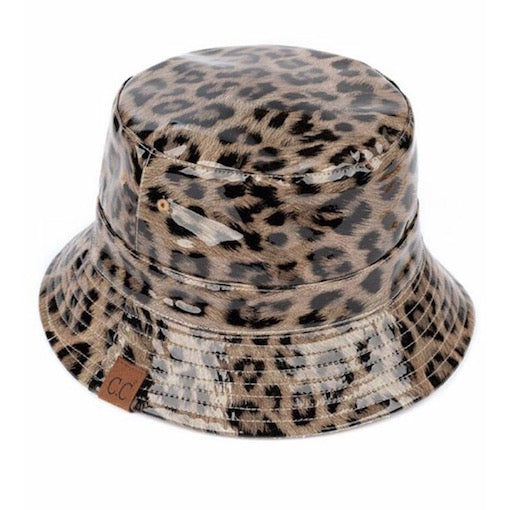 Dark Beige C.C Leopard Patterned Shiny Animal Printed Reversible Rain Bucket Hat; this rain hat is snug on the head and works well to keep rain off the head, out of the eyes, and also the back of neck. Wear it to lend a modern liveliness above a raincoat on trans-seasonal days in the city. Perfect Gift for fashion-forward friend
