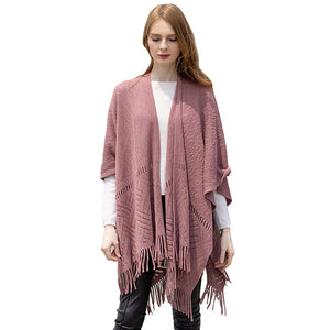 Dust Pink Geometry Open Knit Ruana With Fringe. With this lovely ruana shawl, you can draw attention to the contrast of different outfits. Geometry Pattern With Fringe Design that Gives it a unique decorative and modern look. Match well with jeans and T-shirts or vest, A fashionable eye catcher, will quickly become one of your favorite accessories, warm and goes with all your winter outfits.